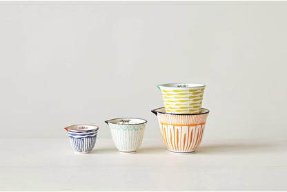 Creative Co-Op 4‑Piece Hand‑Painted Stoneware Measuring Cups with Patterns and Colored Rims, Multicolor2