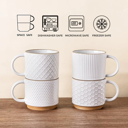 Set of four 12oz textured off-white ceramic coffee mugs with wooden bases stacked in pairs