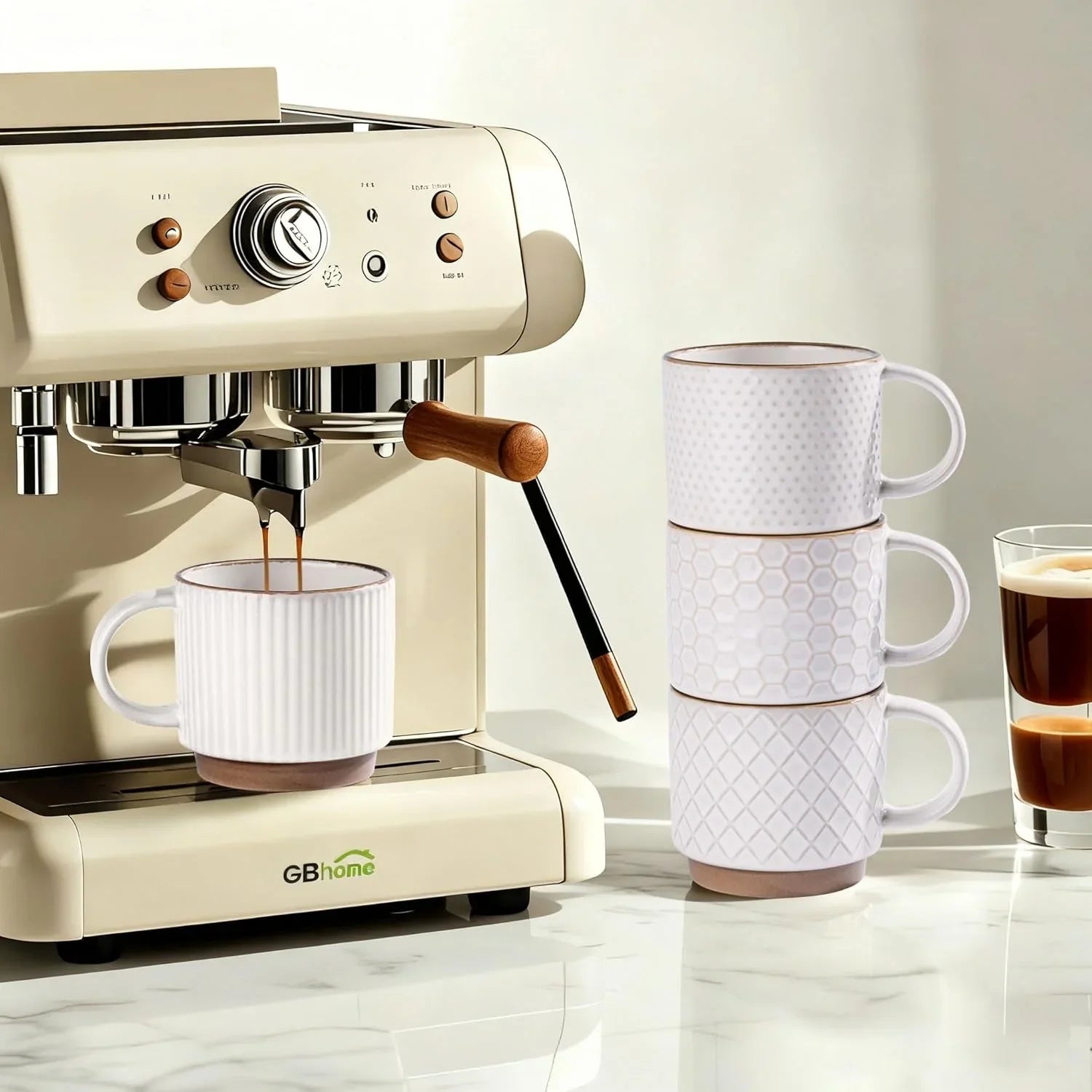 Cream GBhome espresso machine brewing coffee into textured white ceramic mug on marble counter