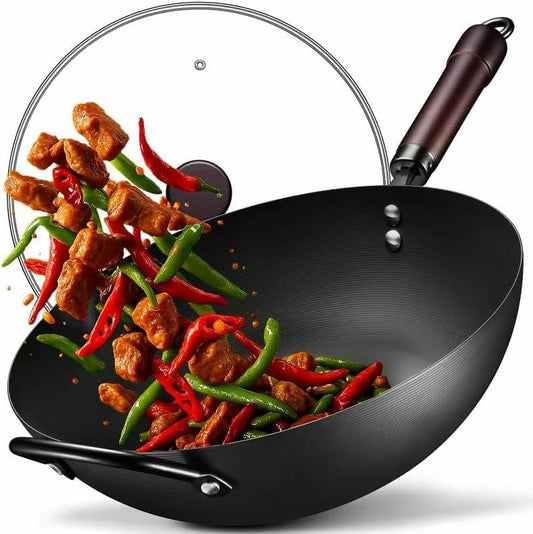 13-inch black carbon steel wok with wooden handle tossing stir-fry with meat, red and green chili peppers
