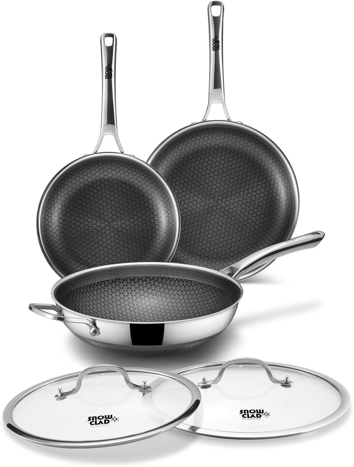 Set of three stainless steel frying pans with nonstick honeycomb pattern and two glass lids