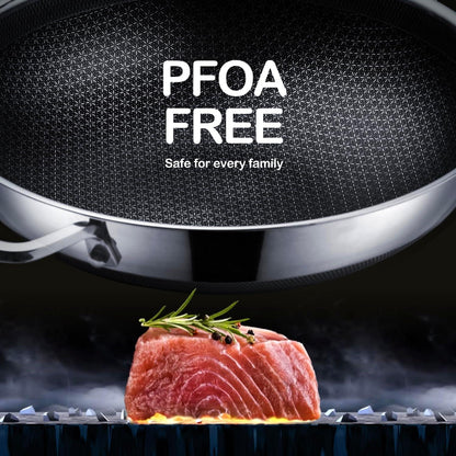 Nonstick stainless steel frying pan with PFOA free label above seared salmon steak garnished with rosemary
