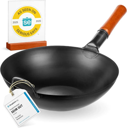 1.35 inch carbon steel wok pan with wooden handle and award tags for quality and serious eats