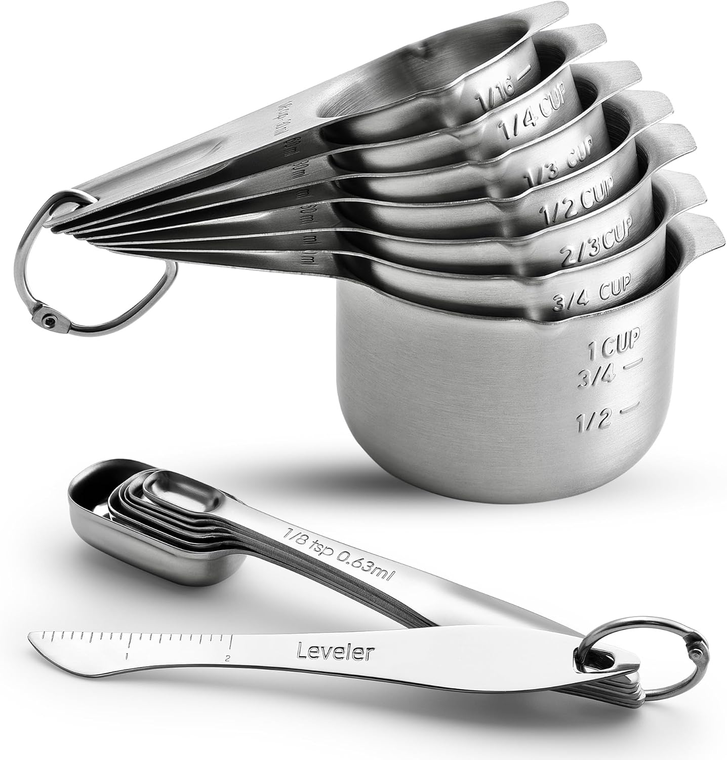 Complete 14-piece stainless steel measuring cups and spoons set with leveler laid out on a countertop.