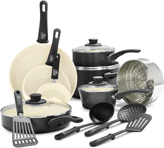 Set of cookware including pots, pans, and utensils on a white background