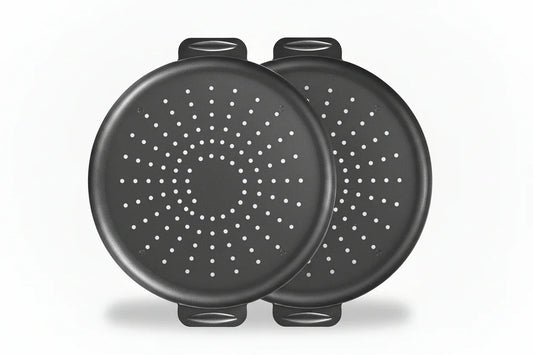 Two 14-inch black nonstick perforated pizza pans with handles on white background