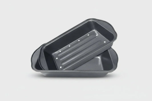 2-piece nonstick metal meatloaf pan set with fat-draining holes on white background
