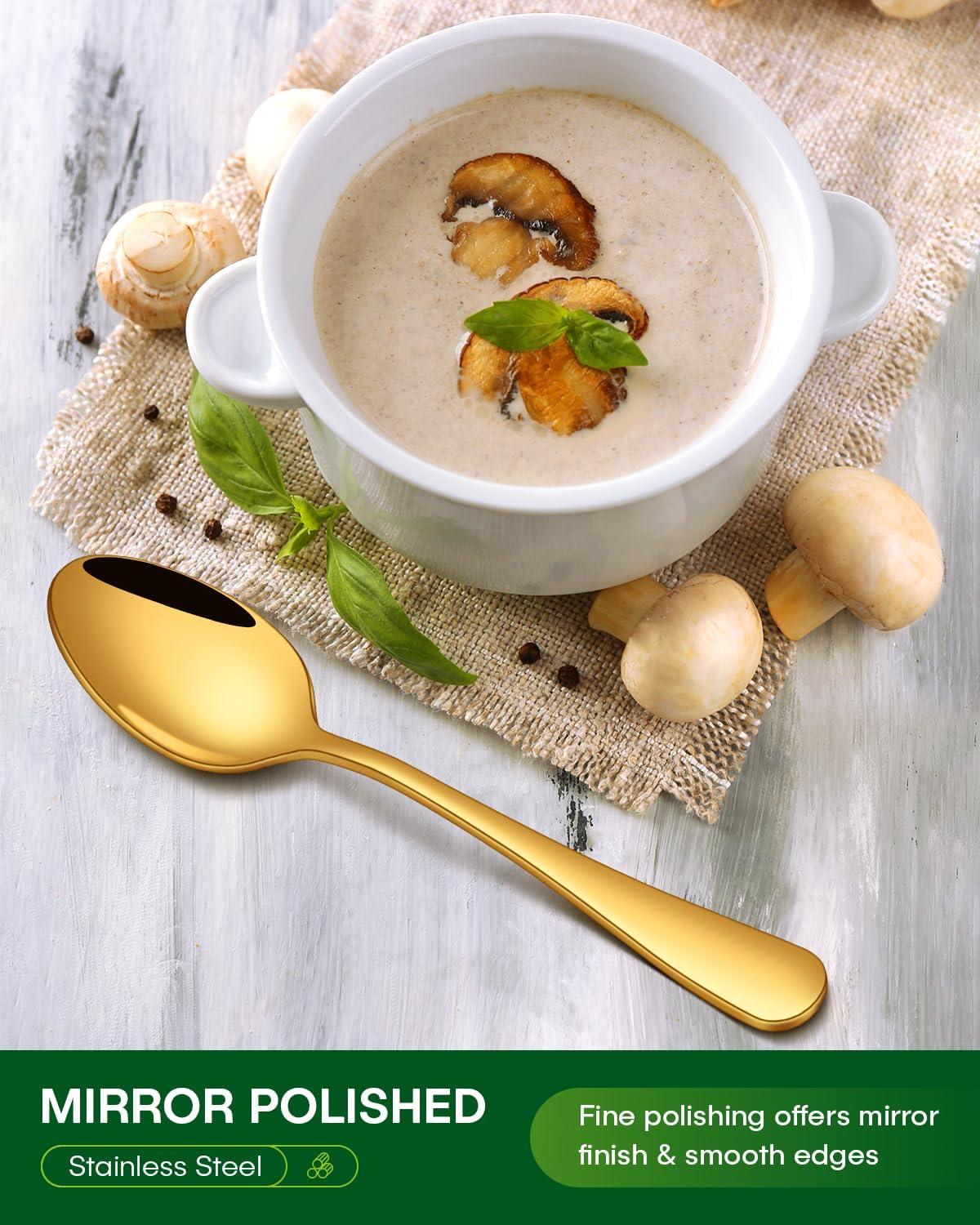Creamy mushroom soup in white bowl with fresh mushrooms and gold stainless steel spoon