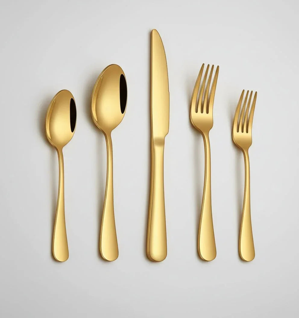 20-piece gold stainless steel flatware set with spoons, knives, and forks on white background