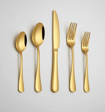 20-piece gold stainless steel flatware set with spoons, knives, and forks on white background