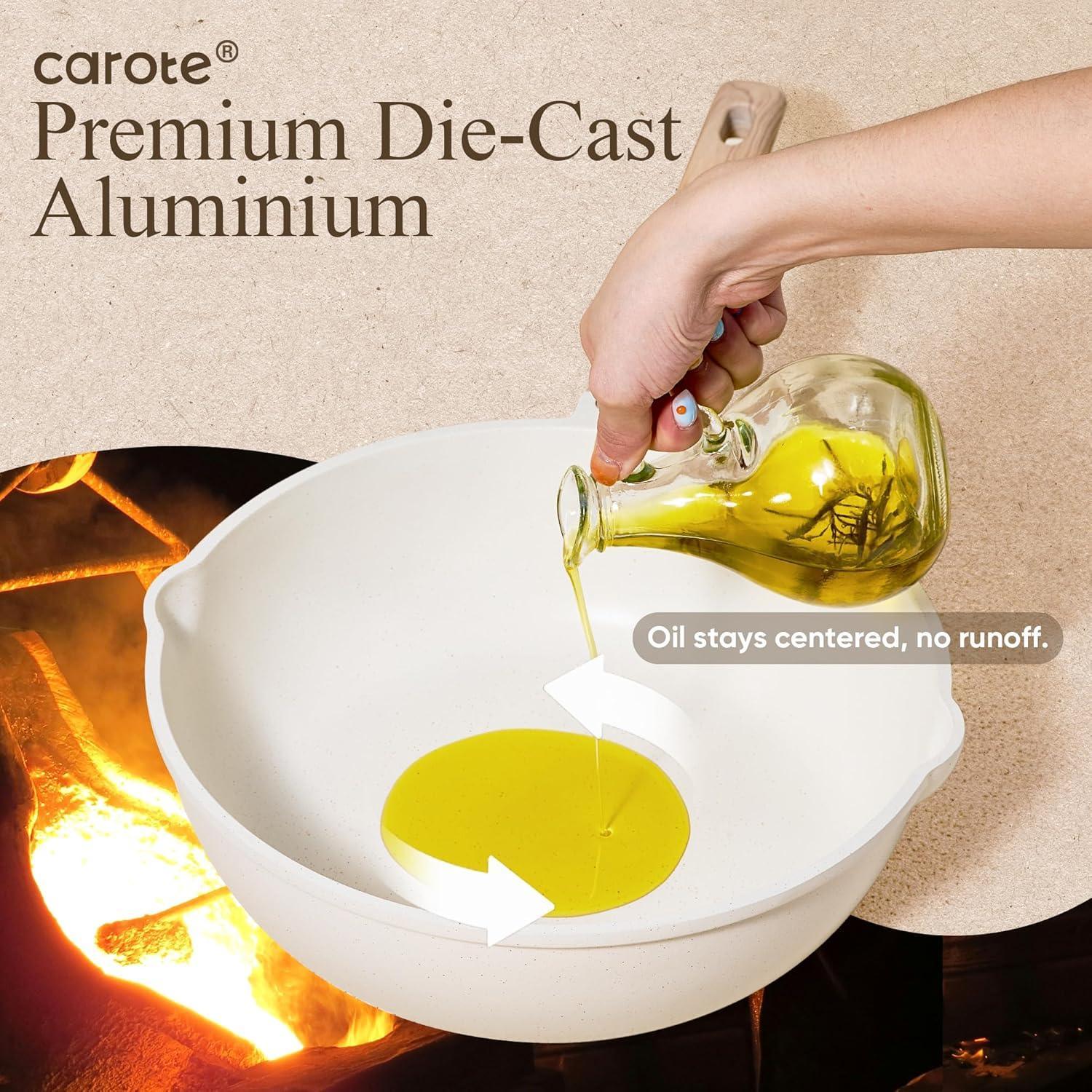 Hand pouring oil into a white nonstick die-cast aluminum frying pan with centered oil pool