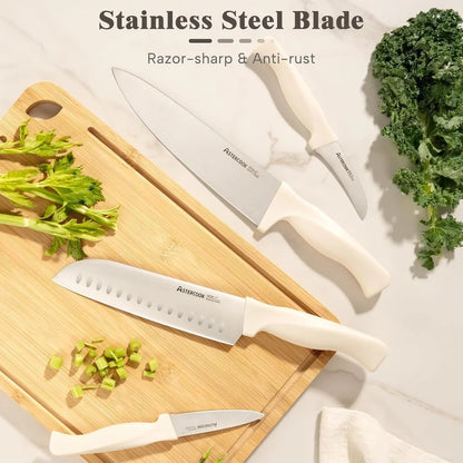 White-handled stainless steel kitchen knives on bamboo cutting board with chopped celery and greens