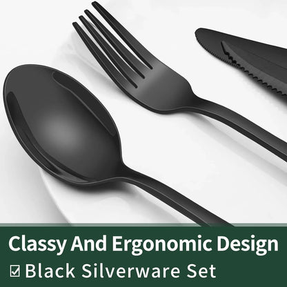 Black stainless steel spoon, fork, and steak knife with ergonomic design on white plate