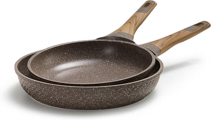 Two stacked brown granite nonstick frying pans with wooden handles on white background