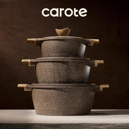 Stack of three textured brown granite nonstick pots with wooden handles and lids, on a beige cloth surface