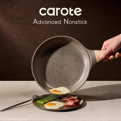 Carote advanced nonstick frying pan with wooden handle flipping cooked egg onto plate with asparagus and bacon