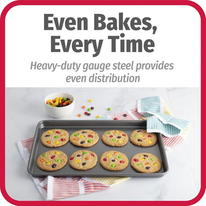 Nonstick carbon steel cookie baking sheet with eight freshly baked colorful candy cookies on a kitchen towel