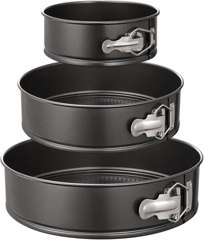 Three nonstick springform cake pans in 6, 8 and 10 inch sizes arranged together.