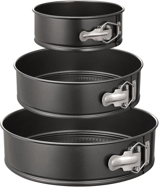 Three nonstick springform cake pans in 6, 8 and 10 inch sizes arranged together.