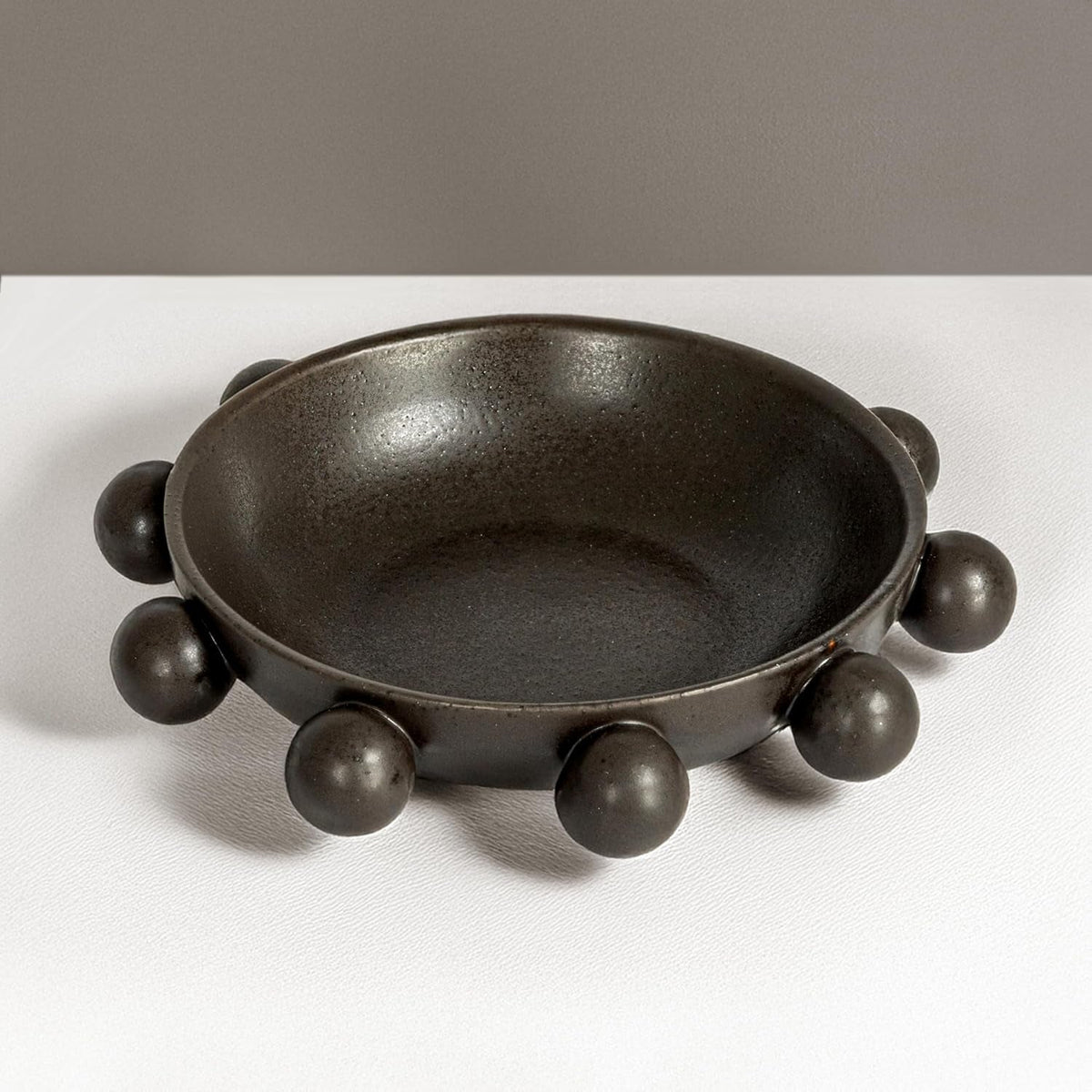 9-75-inches-stoneware-bowl-with-orbs-and-reactive-glaze-black