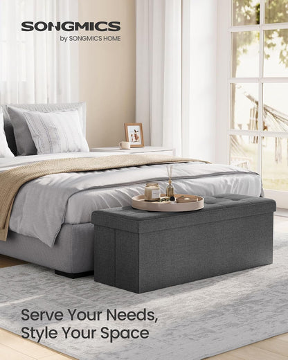 SONGMICS MAZIE Collection - 43 Inches Folding Storage Ottoman Bench, Ottoman Foot Rest, End of Bed Bench, Storage Chest, Load 660 Lb, for Living Room, Bedroom, Entryway, Dark Gray ULSF77K3