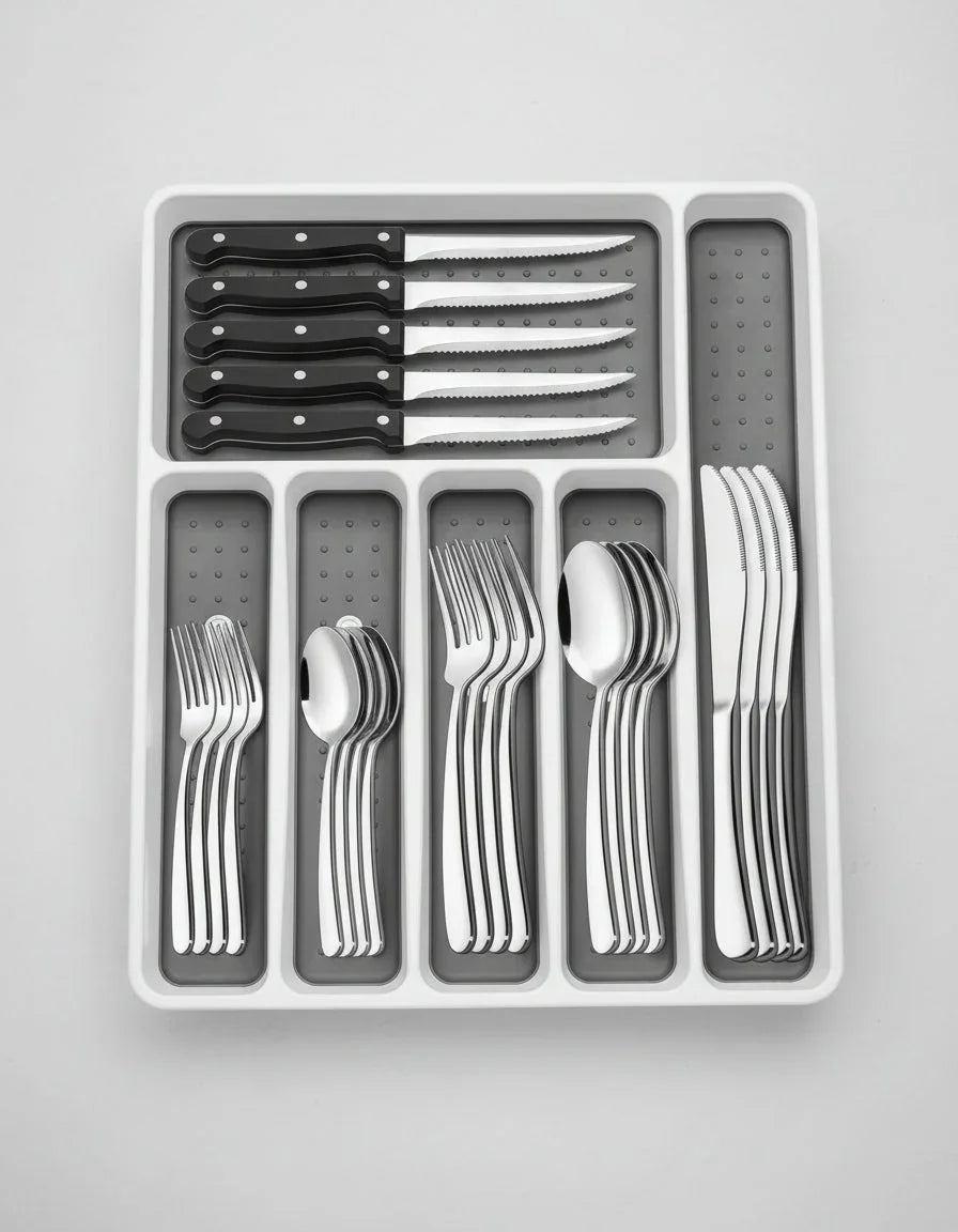 49-piece stainless steel silverware set with black-handled steak knives in white organizer tray