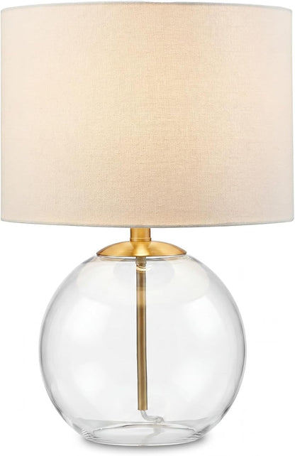 Signature Design by Ashley Glass Table Lamp, Modern Bedside, Clear & Brass | White Fabric Drum Shade, Compact round Clear Glass Profile for Modern Nightstands, Samder Series1