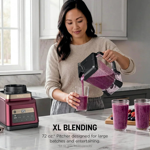 Woman pouring a purple smoothie from a Ninja blender pitcher into a glass.3