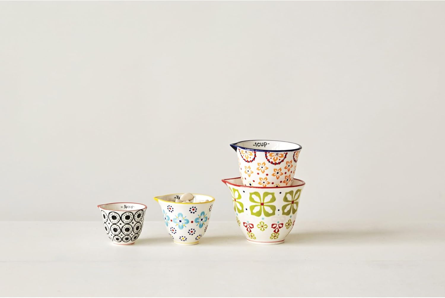 creative-co-op-floral-hand-stamped-stoneware-measuring-cups-set-of-4-sizes-designs