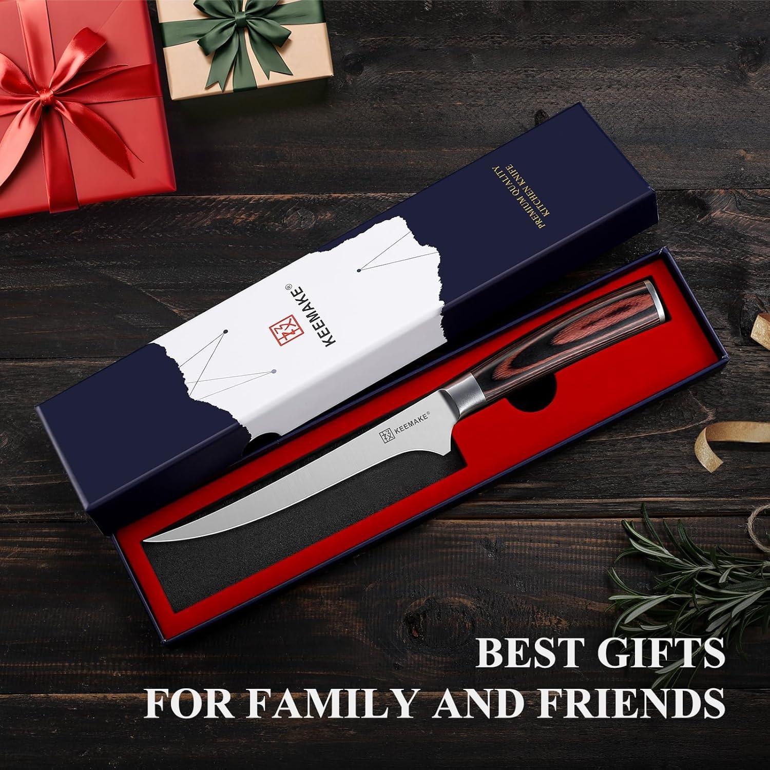 6-inch KEEMAKE boning knife with wooden handle in gift box on dark wood background with wrapped presents