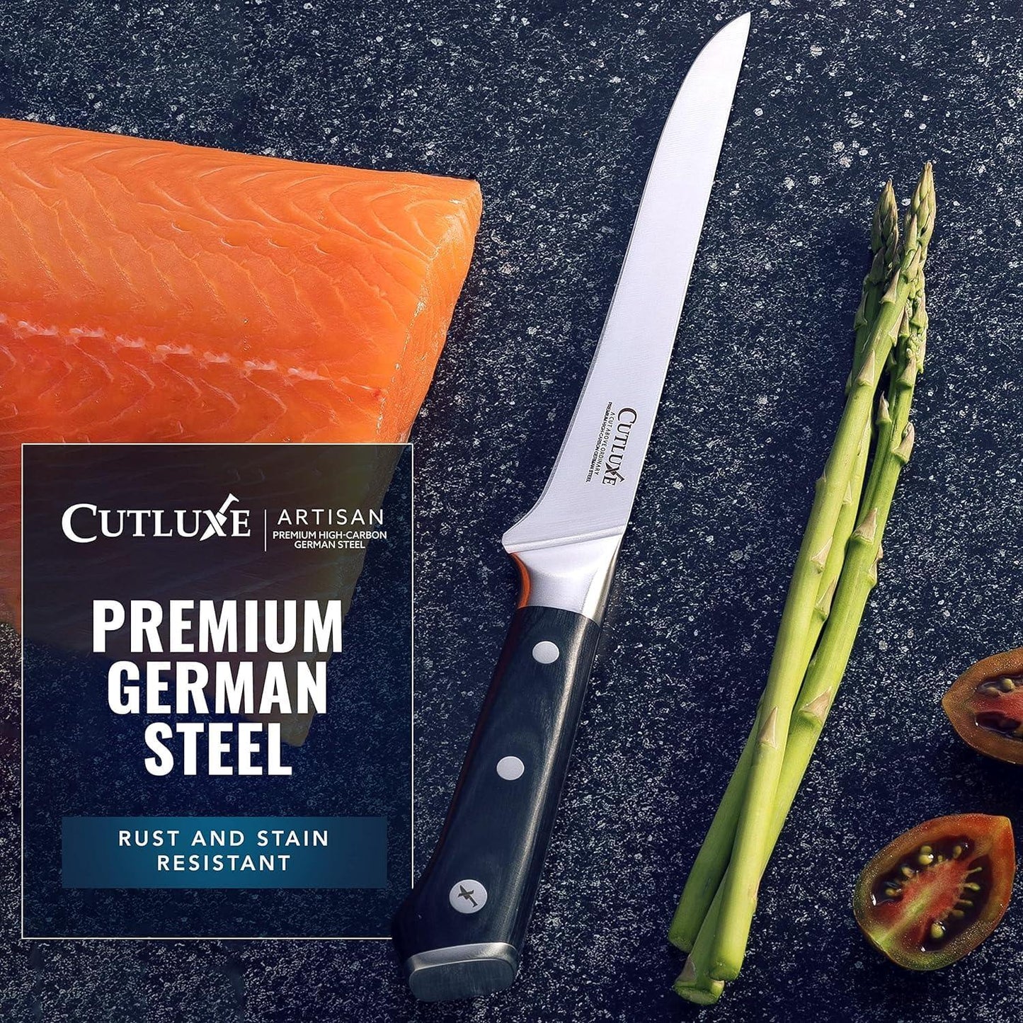6-inch Cutluxe artisan boning knife with black handle next to fresh salmon, asparagus, and tomato on dark surface