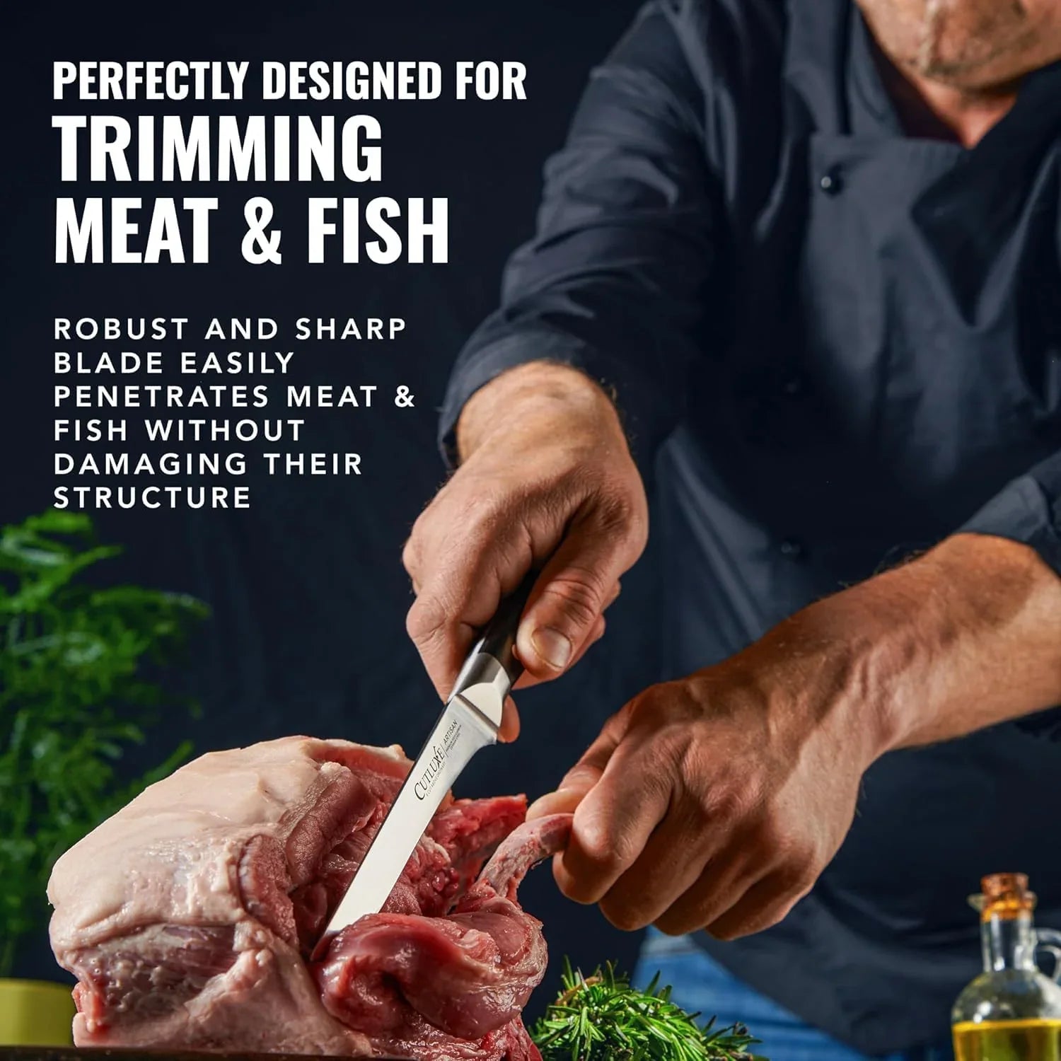Chef using a sharp boning knife to trim raw meat with herbs and olive oil nearby