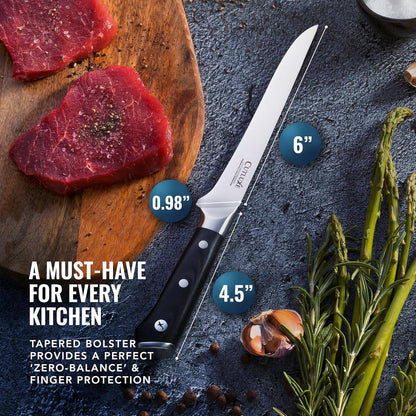 6-inch boning knife with black handle on dark surface with raw steak, asparagus, garlic, and peppercorns
