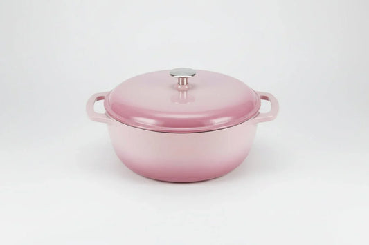 6-quart light pink enameled cast iron Dutch oven with lid on white background