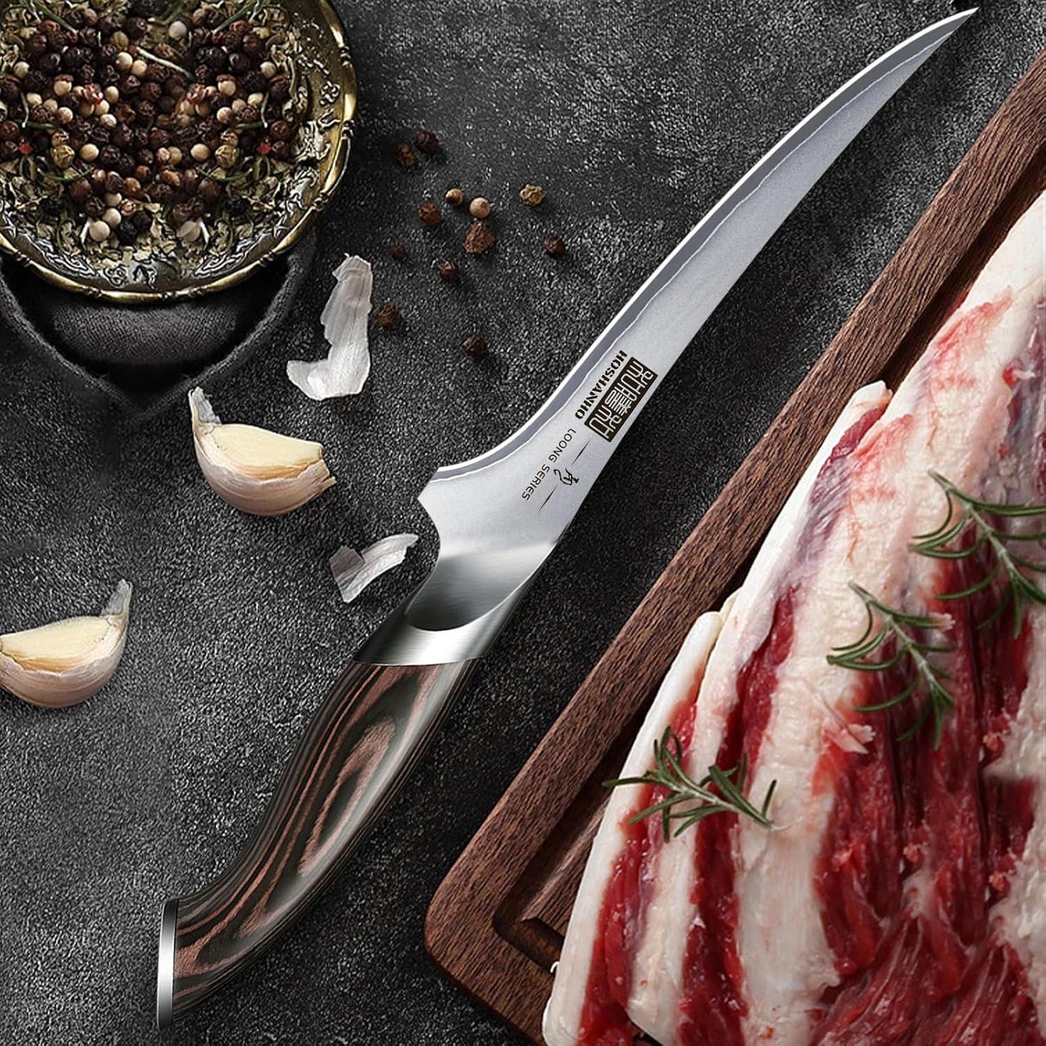 7-inch Japanese high carbon boning fillet knife with wooden handle on dark surface with garlic and peppercorns