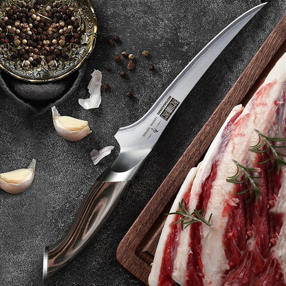 7-inch Japanese high carbon boning fillet knife with wooden handle on dark surface with garlic and peppercorns