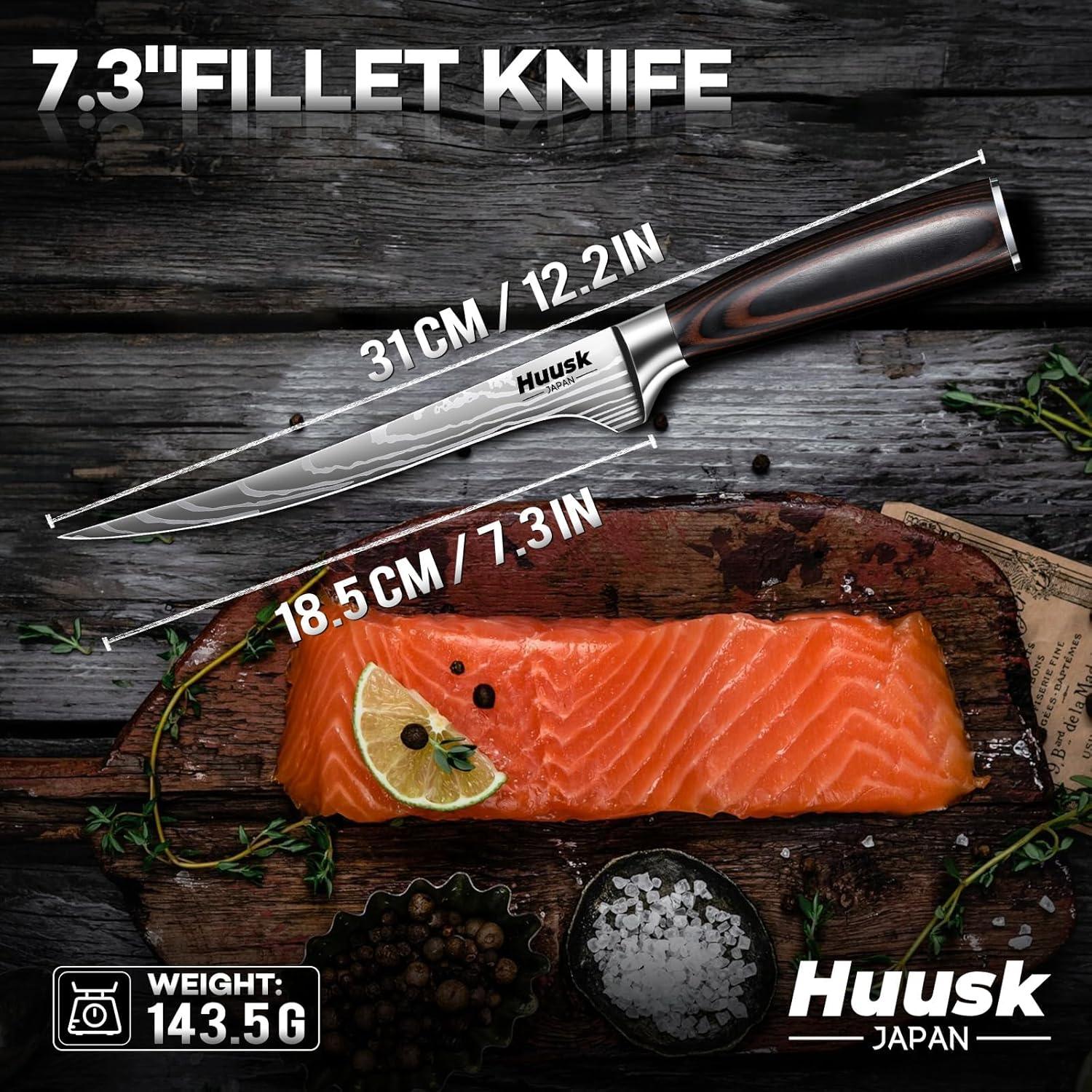 7.3-inch fillet knife by Huusk Japan with wooden handle beside fresh salmon fillet on wooden board