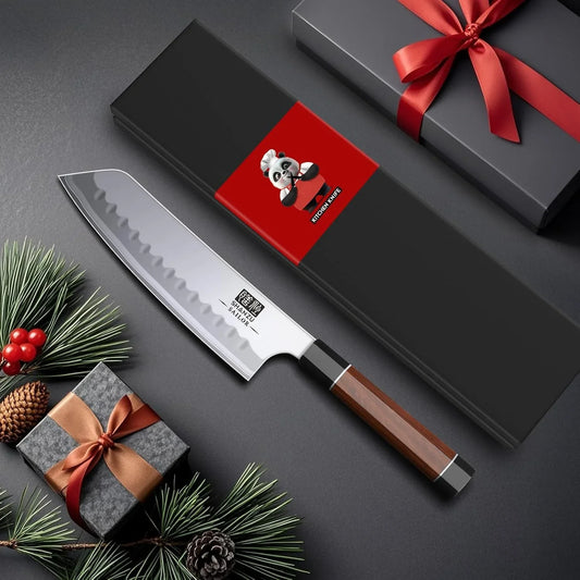 7-inch Japanese chef knife with wooden handle and wavy high-carbon steel blade near gift boxes