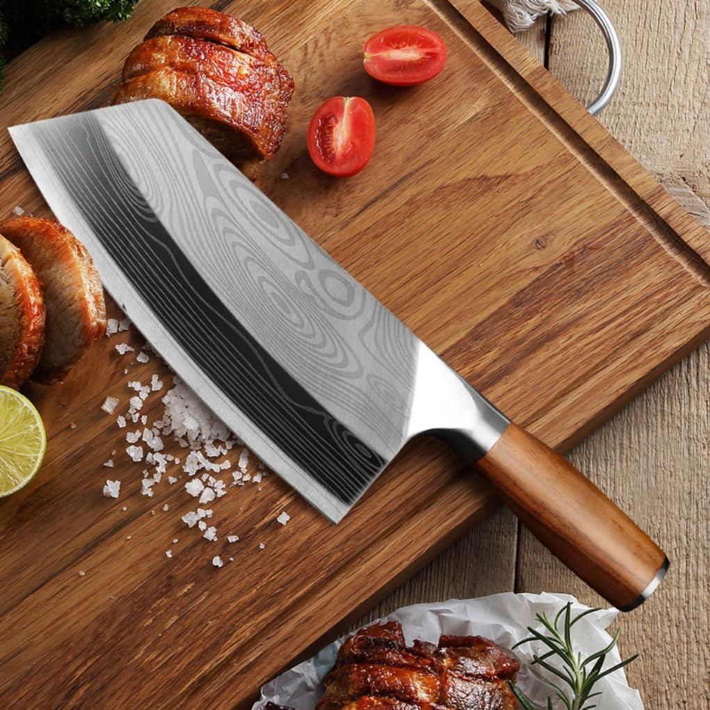 7-inch German stainless steel meat cleaver with wooden handle on wooden cutting board with sliced meat, lime, tomato