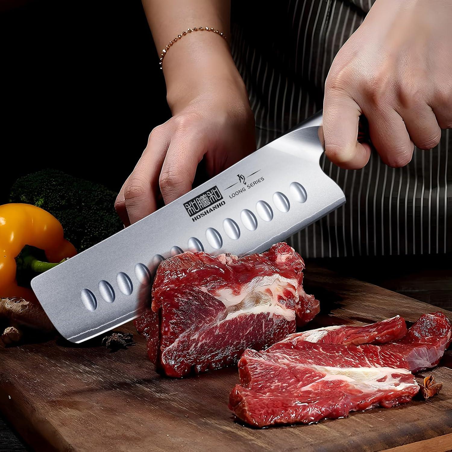 Hoshanno Loong Series chef slicing raw red meat on wooden board with high carbon stainless steel nakiri knife