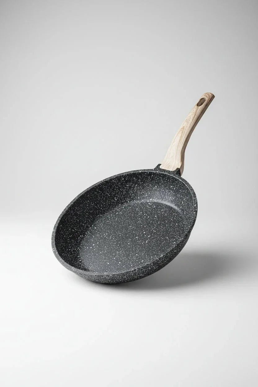 8-inch black granite nonstick frying pan with wood-style handle on white background