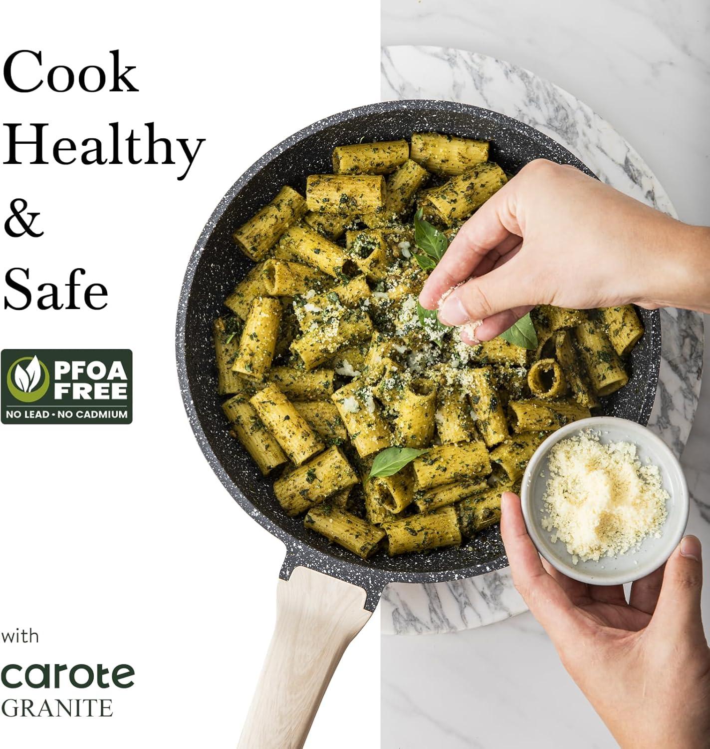 Granite nonstick frying pan with herb pasta topped with grated cheese, healthy and PFOA free skillet