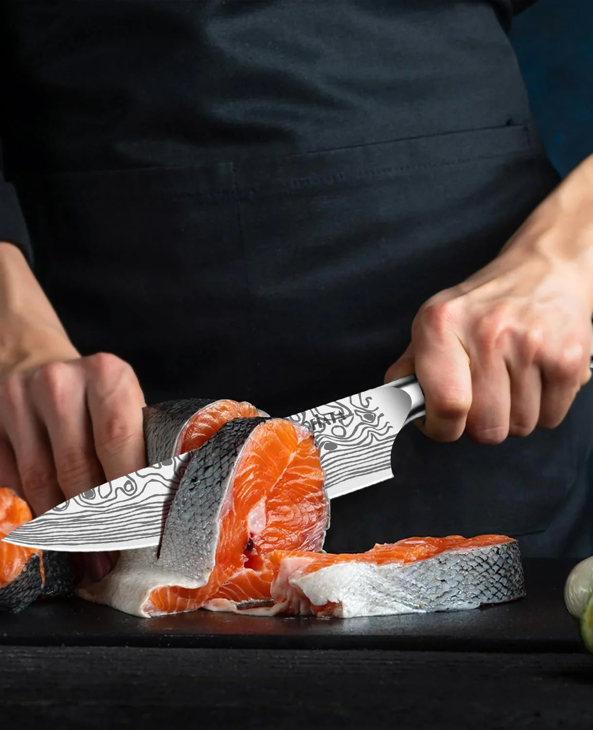 Professional chef cutting fresh salmon fillet with an 8-inch German high carbon steel chef knife