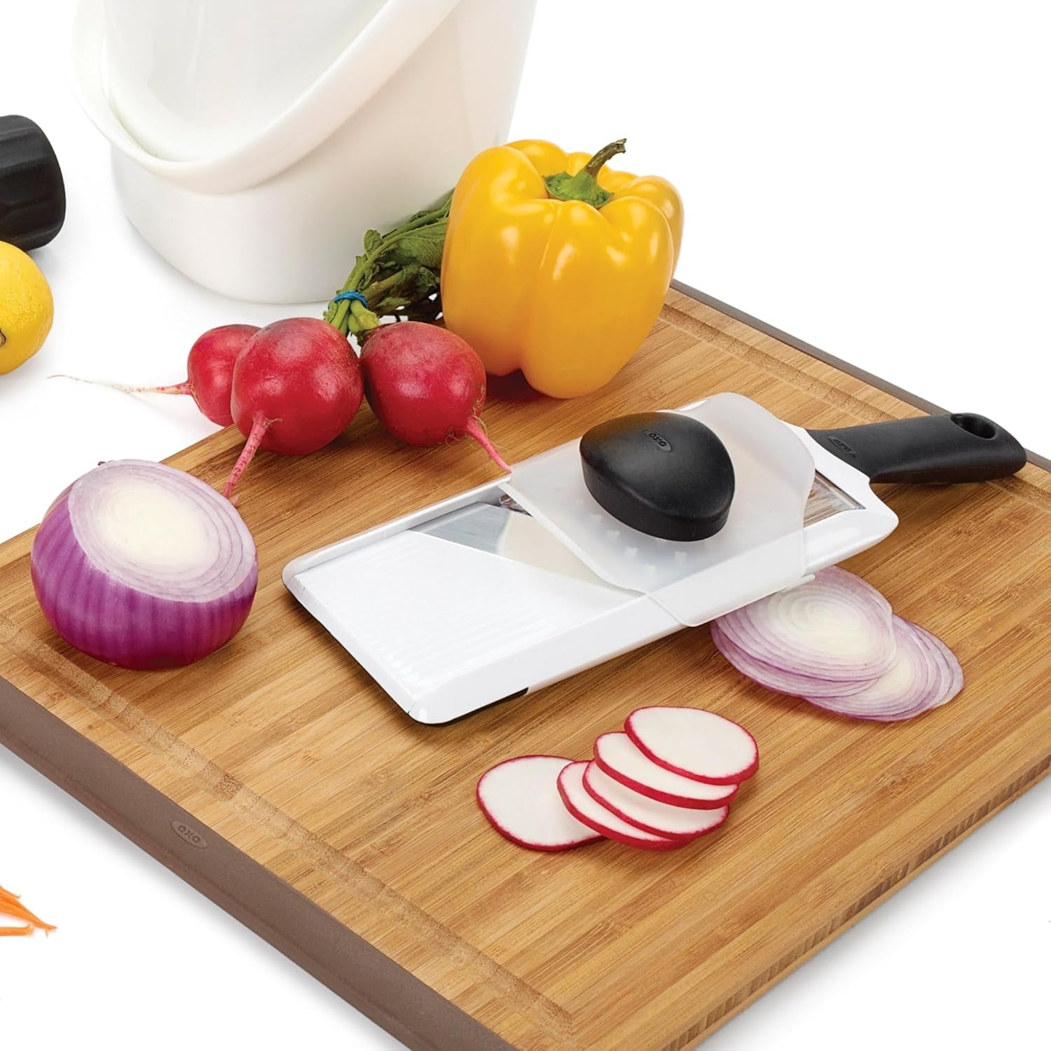 oxo-good-grips-handheld-mandoline-slicer-with-non-slip-handle-for-kitchen-adjustable-thickness-settings-hand-guard-included-slice-vegetables-and-fruit-easy-clean-design-non-slip-grip