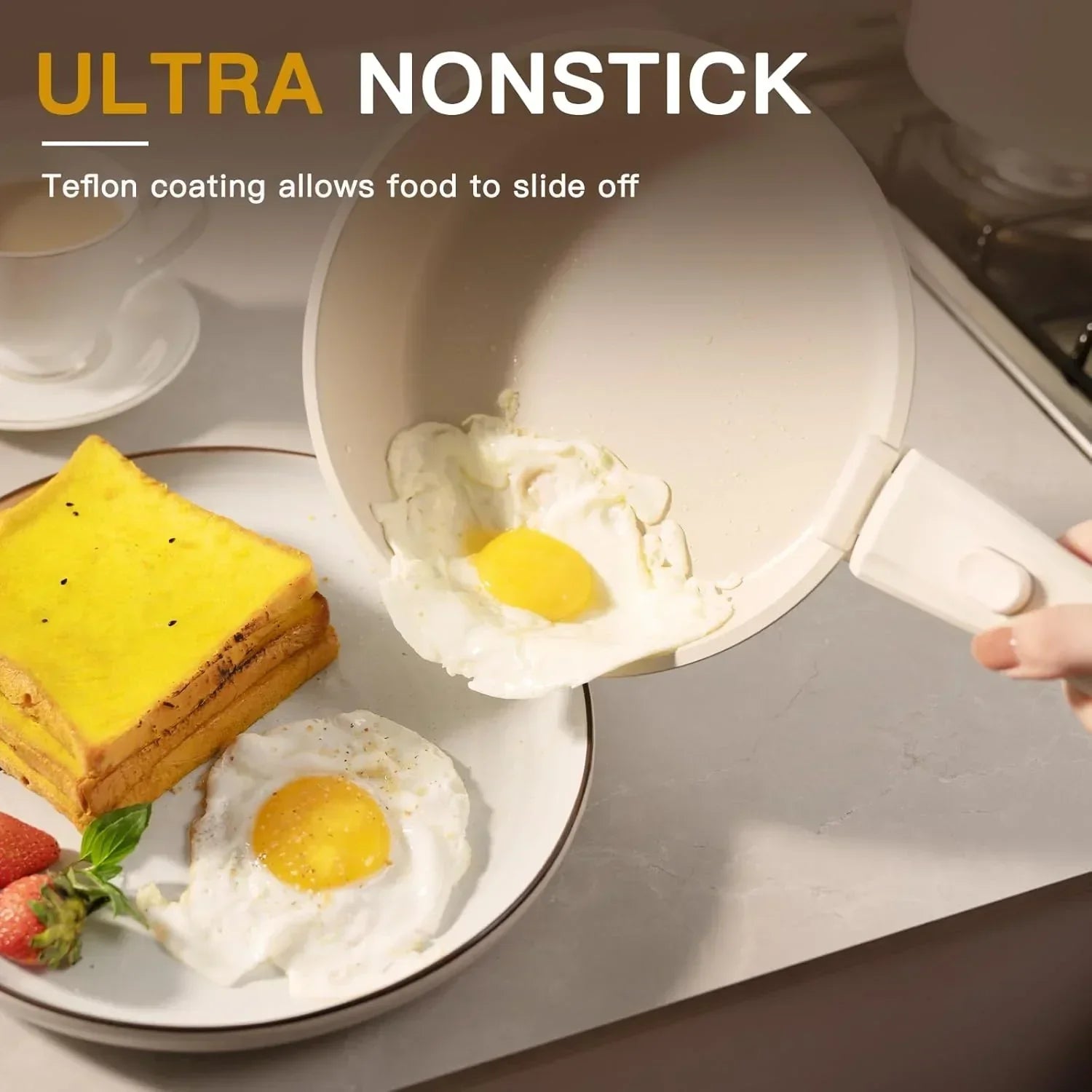 Nonstick frying pan sliding fried eggs onto a plate with toast and strawberries, kitchen setting