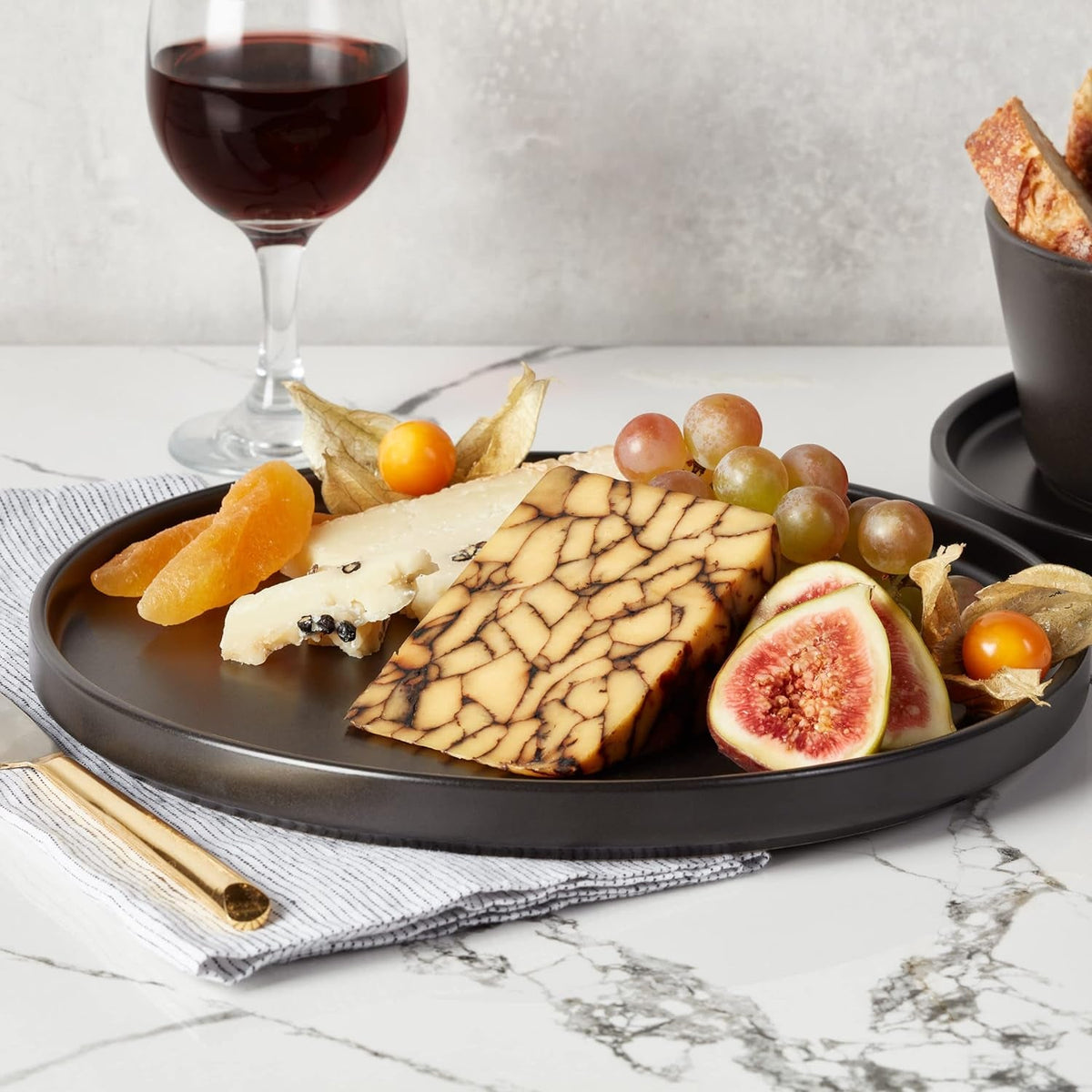 stone-lain-celina-stoneware-16-piece-dinnerware-set-plates-and-bowls-black-matte-dish-service-for-4-minimalist-round-style-microwave-dishwasher-safe