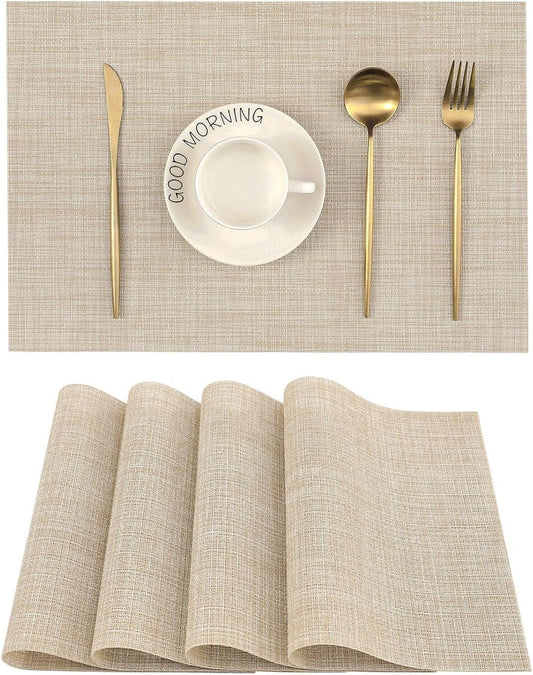 Beige heat-resistant non-slip placemats set of 4 on dining table with gold cutlery and white cup and saucer