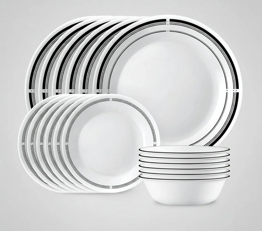 18-piece white round dinnerware set with black geometric border pattern, including plates and bowls