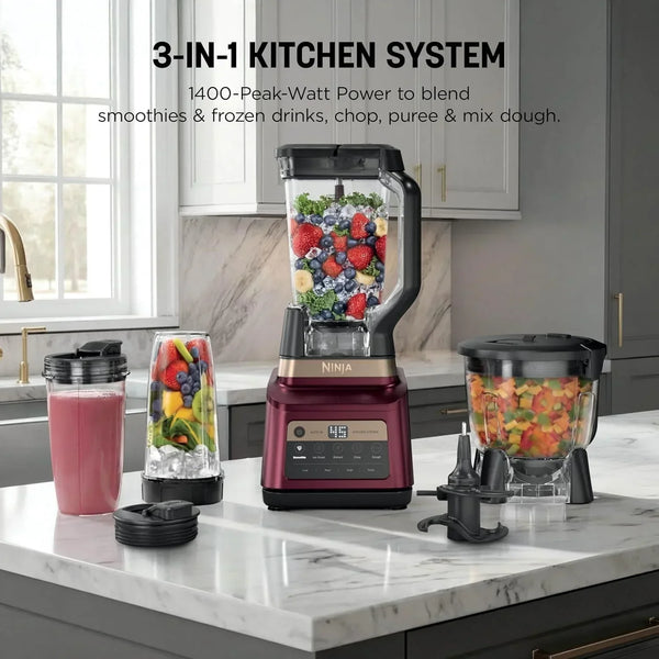 Ninja 3-in-1 kitchen system blender with fruit-filled jars on a marble countertop2