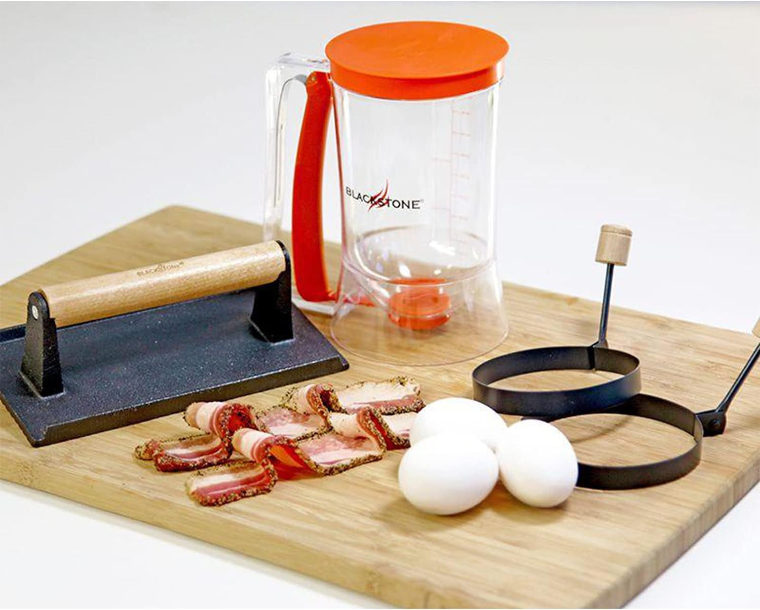 blackstone-1543-outdoor-griddle-breakfast-preparation-kit-with-pancake-batter-dispenser-cast-iron-bacon-press-and-2-non-stick-steel-egg-rings-batter-dispenser-bacon-press-two-egg-rings